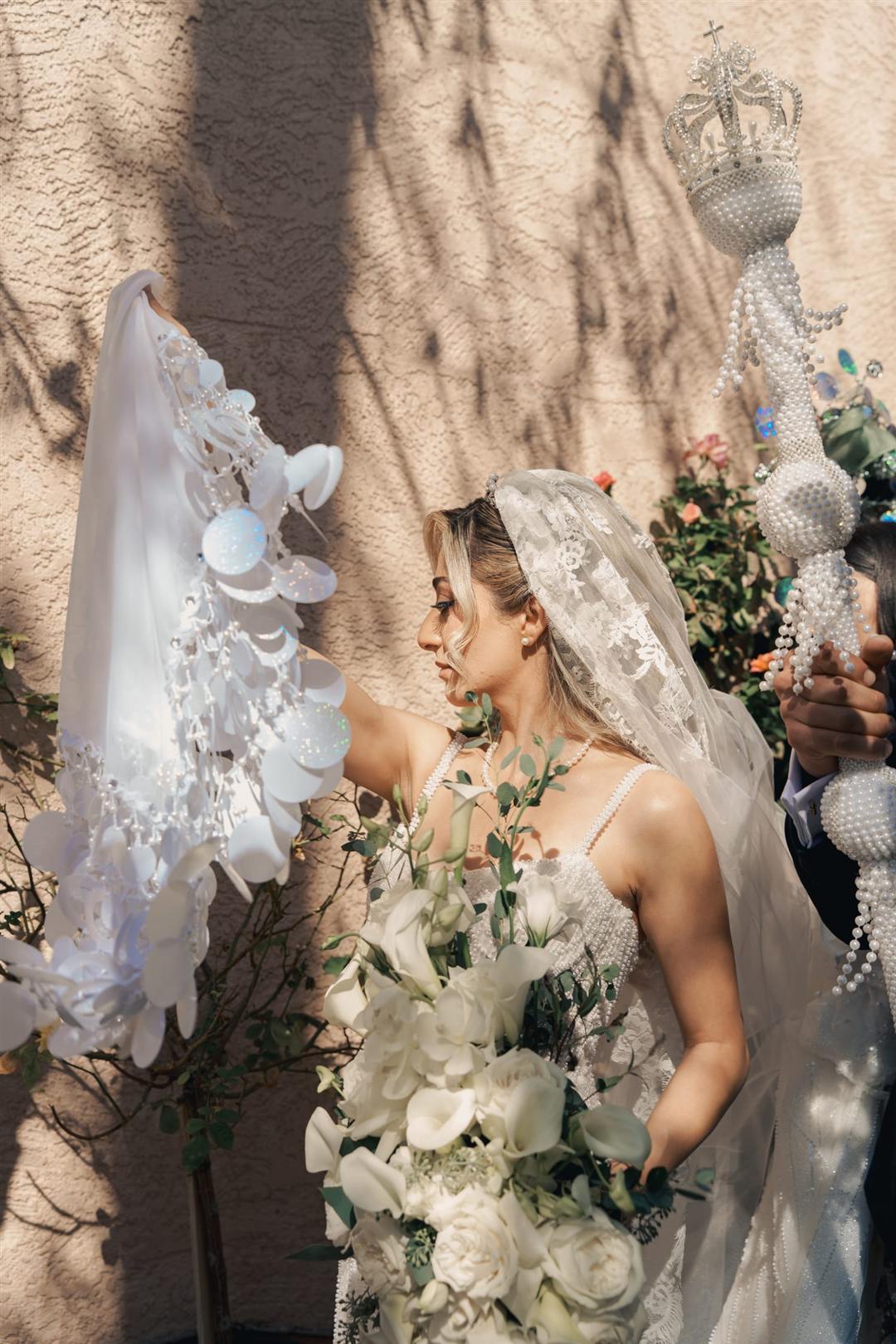 Bride's veil catching the light at golden hour